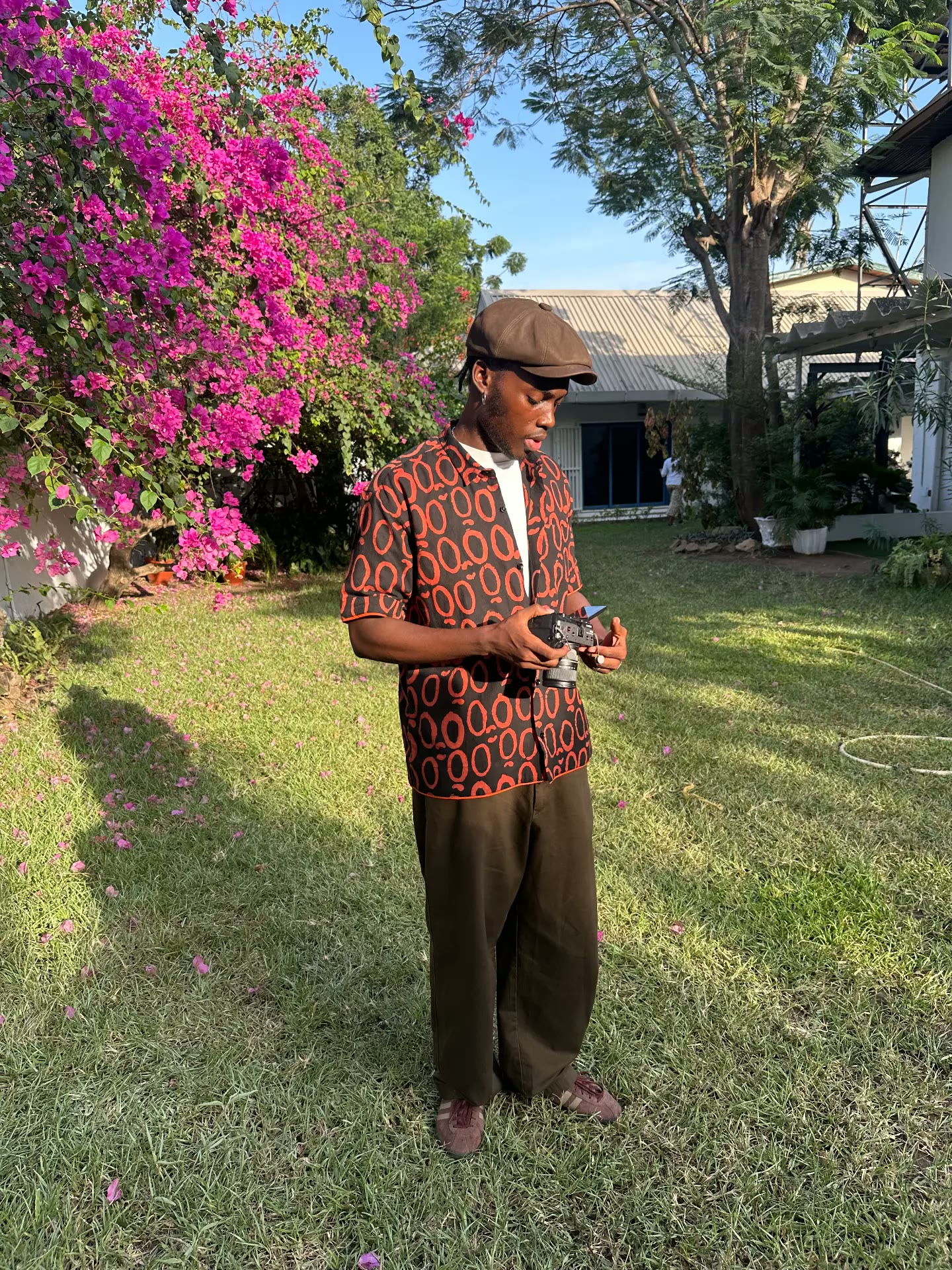 Tomisin Okupe holding a cinema camera